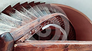 Old mahogany wooden spiral staircase, top view