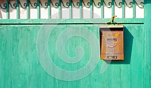 Old Mailbox on a green gate