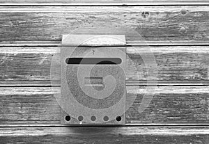 Old mailbox on wooden door