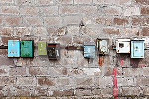 Old mailboxes on an old dirty wall