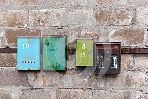 Old mailboxes on an old dirty wall