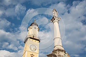 Old main square in Banska Bystrica, Slovakia. Clock tower, marian column in sunny day