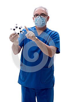 Old male doctor holding molecular model