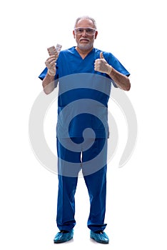 Old male doctor suggesting pills isolated on white