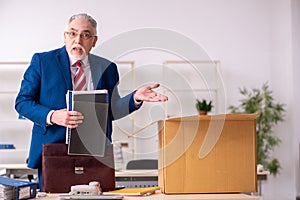 Old male employee in movement concept