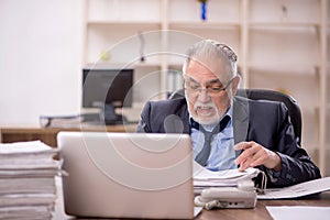 Old male employee and too much work in the office
