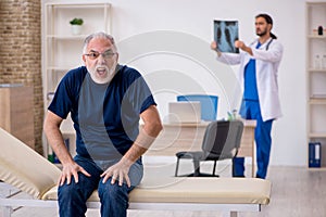 Old male patient visiting young male doctor radiologist