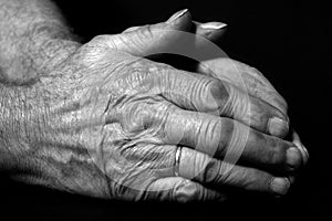 Old male praying hands photo