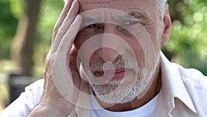 Old male suffering migraine, health problems, brain cancer risk, painkillers photo