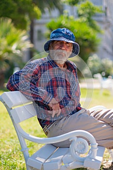 old man with a beard in a panama hat