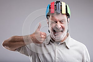 Old man with bicicle head protection photo