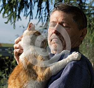 old man with a cat