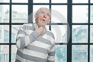 Old man is coughing.