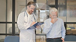 Old Man Coughing while Talking with Doctor