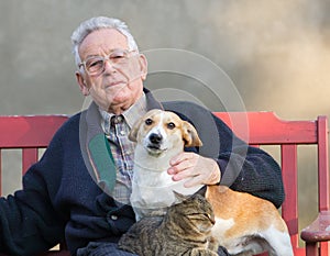 Old man with dog and cat