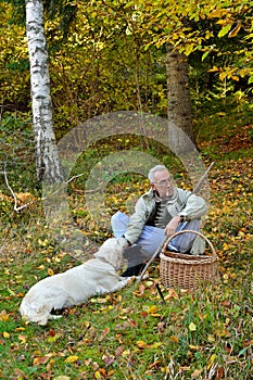 Old man and dog mushrooming