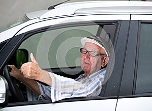 Old man driving car