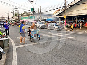 An old man driving his custome blue tricycle on the street of Paknampran, Hua Hin Thailand December 22, 2018