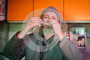 Old man gnawing bone