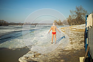 Old Man Going To Swim In The Winter Lake In The Ice Hole