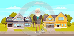 Old man grandfather with gray hair and beard standing with his pet dog on hut green street