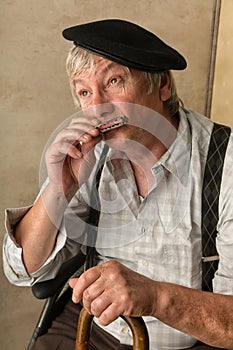 Old man with harmonica