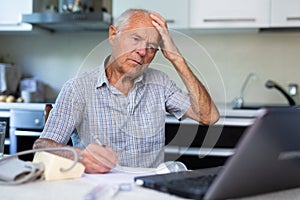 Old man having online medical consultation through internet