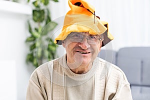 old man head shot celebrating halloween at home