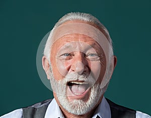 Old man laughing hilariously photo