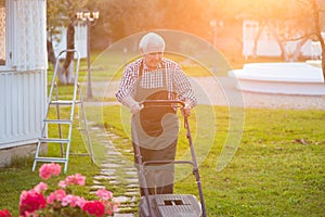 Old man with lawn mower.