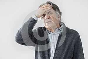 Old man measuring his fever