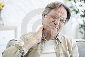 Old man with neck pain photo