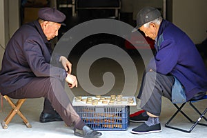 Old man play Chinese Chess