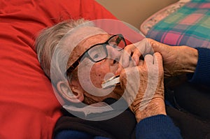 Old man play harmonica