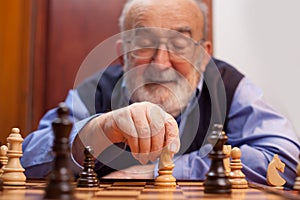 Old man playing chess