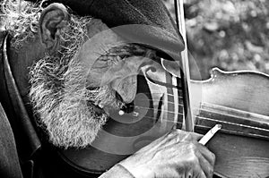 Old man playing violin