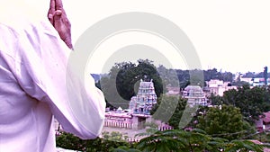 Old man praying hindu temple at india