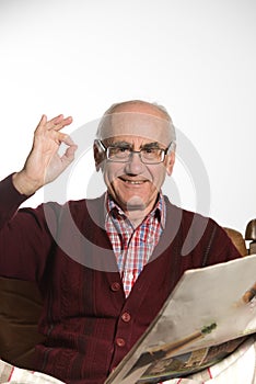 Old man reading newspapper photo