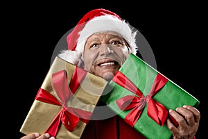 Old Man In Red Gaping Across Two Wrapped Gifts