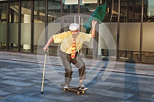 Old man is riding a skateboard.