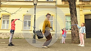 Old man rope skipping with three girls.