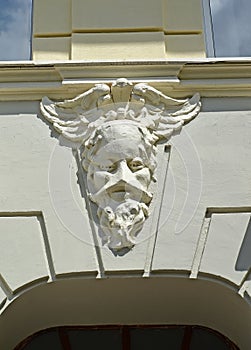 The old man `s masqueron on the facade of the building. Sovetsk, Kaliningrad region