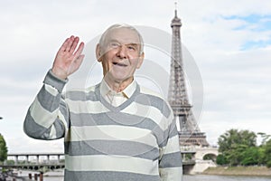 Old man saying hello in Paris.