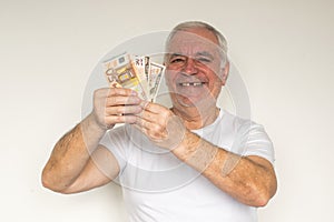 Old man senior face closeup missing tooth smile proper tooth care white t shirt visit dentist