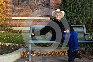 Old Man Sitting on a Park Bench