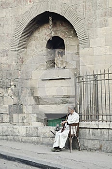 Old man smoking in cairo in egypt