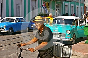 Old man smoking a cigar in the street