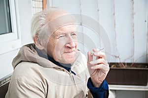 Old man smoking a cigarette