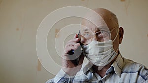 Old man speaks on the phone