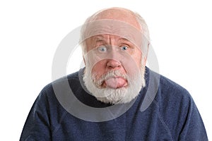 Old man sticking out his tongue isolated on white